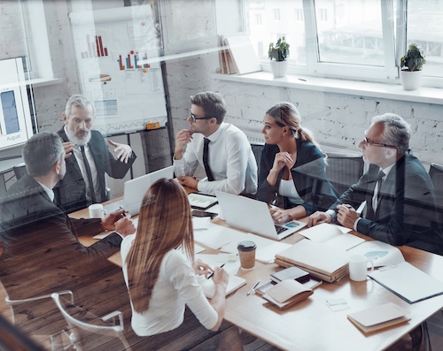 A business team analysing content strategy in board room