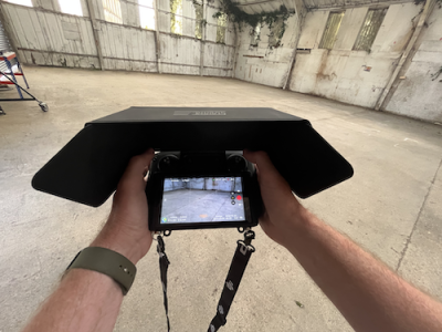 POV of a cameraperson filming in an industrial workspace