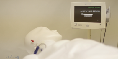 Still from video of a medical dummy demonstrating medtech device